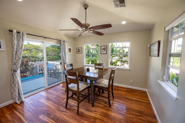 dining area with dark wood-type flooring and plenty of natural light