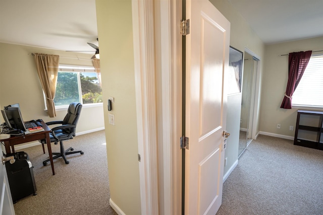 office space featuring a healthy amount of sunlight and light colored carpet