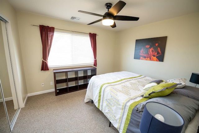 carpeted bedroom featuring a closet and ceiling fan