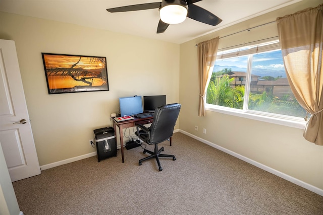 office area with ceiling fan, carpet flooring, and a wealth of natural light