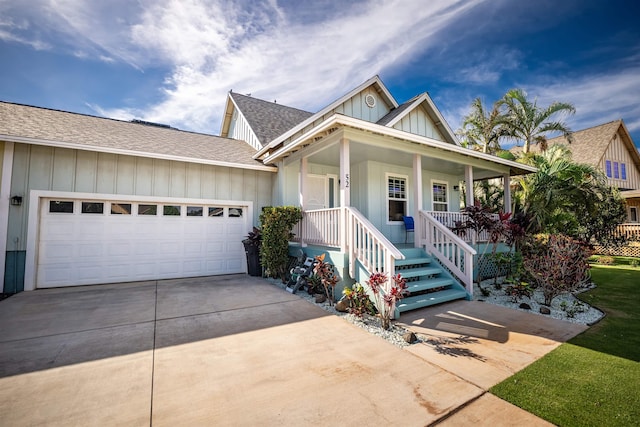 view of front of home featuring a garage and a porch