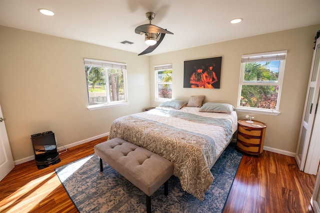 bedroom featuring dark hardwood / wood-style floors and ceiling fan