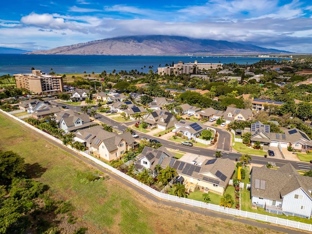 drone / aerial view with a water and mountain view