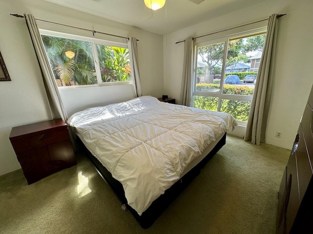 bedroom featuring ceiling fan and carpet flooring