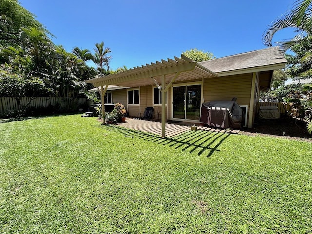 back of house featuring a pergola, a patio, and a yard