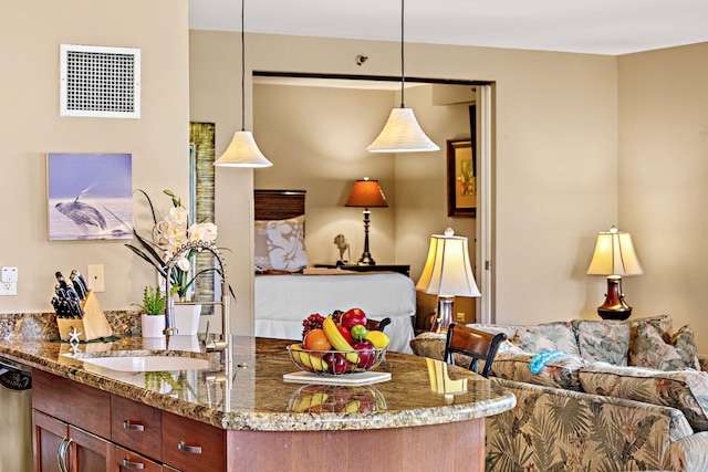 50 Nohea Kai Dr Unit 2-702, Lahaina, HI 96761 - kitchen with open floor plan, stone countertops, dishwasher, and hanging light fixtures