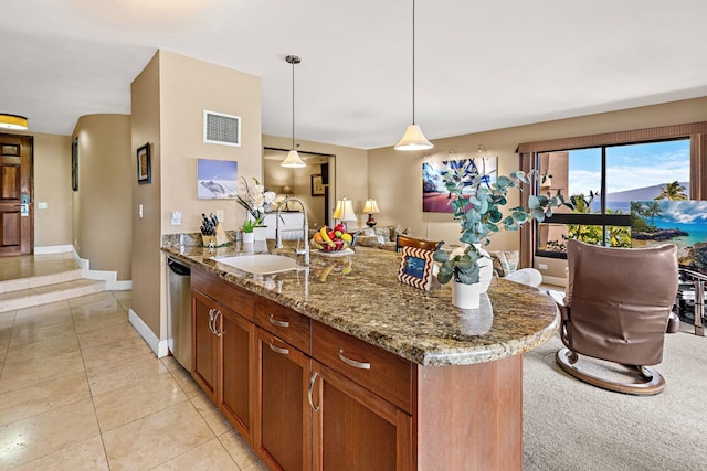 50 Nohea Kai Dr Unit 2-702, Lahaina, HI 96761 - kitchen featuring a peninsula, light stone counters, stainless steel dishwasher, brown cabinets, and decorative light fixtures