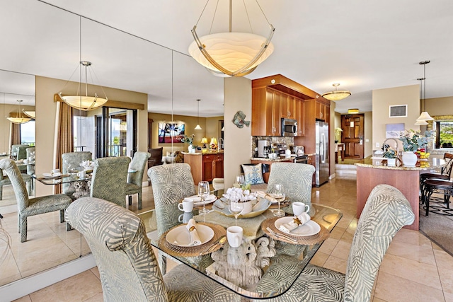 50 Nohea Kai Dr Unit 2-702, Lahaina, HI 96761 - dining area featuring plenty of natural light and light tile patterned floors