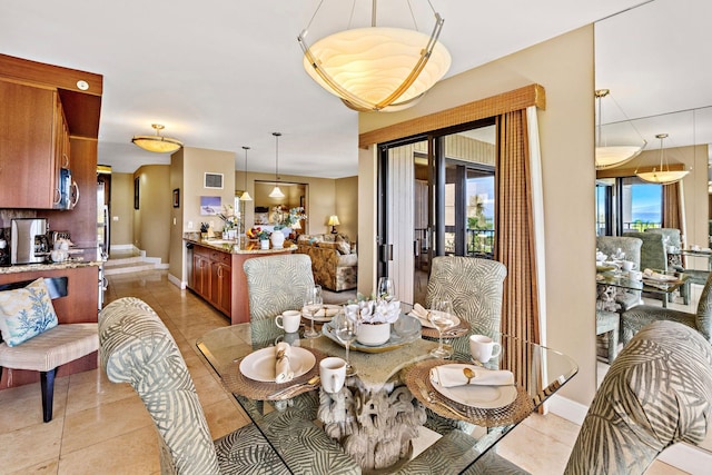 50 Nohea Kai Dr Unit 2-702, Lahaina, HI 96761 - dining area with light tile patterned floors and baseboards
