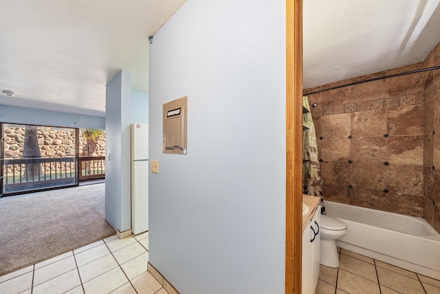 full bathroom with toilet, vanity, tile patterned floors, and shower / tub combo with curtain