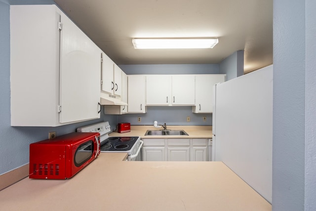 kitchen featuring sink, white refrigerator, white cabinetry, and electric stove