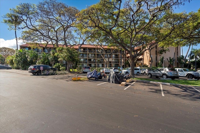 view of property with uncovered parking