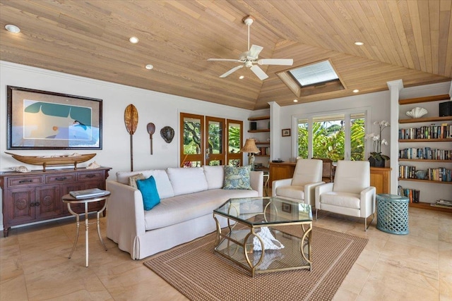 living room featuring light tile patterned flooring, ceiling fan, built in shelves, wooden ceiling, and a skylight