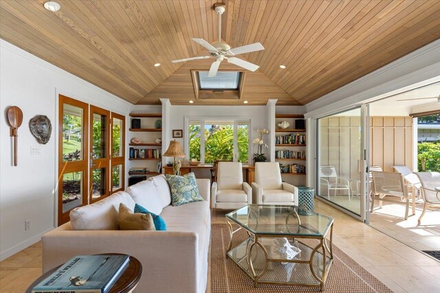 living room featuring light tile patterned floors, built in shelves, ceiling fan, vaulted ceiling with skylight, and wooden ceiling