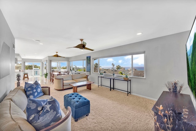 living room featuring carpet floors and ceiling fan