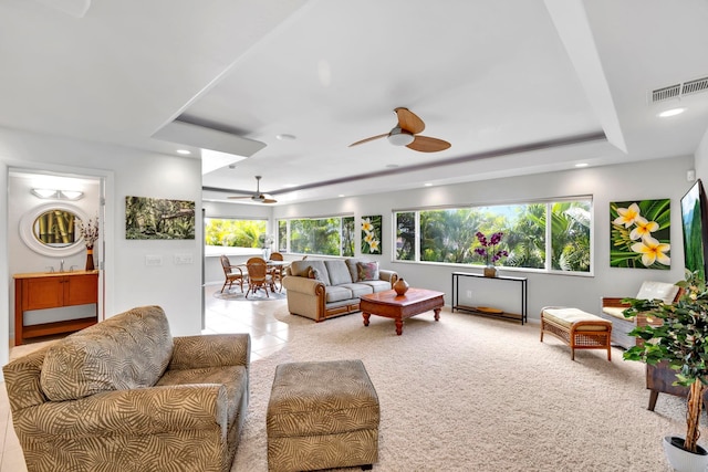 living room with ceiling fan and sink