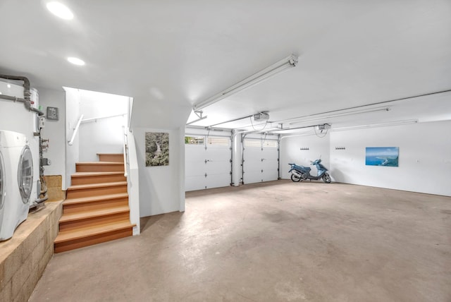 garage featuring washer / dryer and a garage door opener