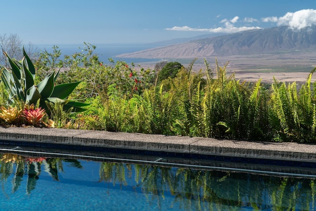 view of pool featuring a mountain view