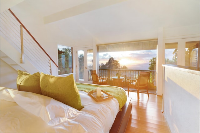 bedroom featuring wood-type flooring and french doors