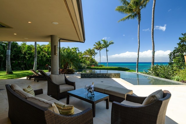 view of patio with an outdoor living space and a water view