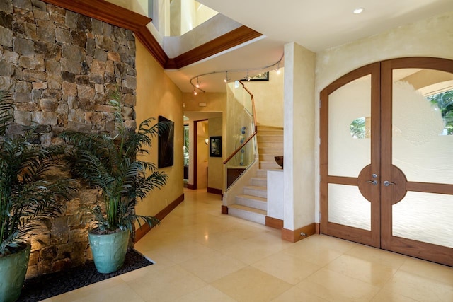 entryway featuring french doors and rail lighting