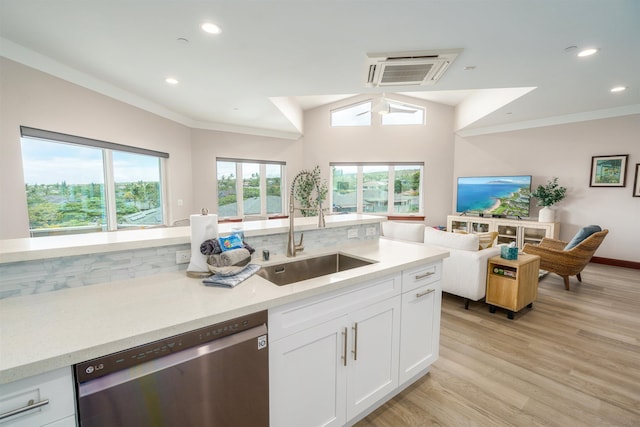 kitchen with white cabinets, dishwasher, sink, light wood-type flooring, and crown molding