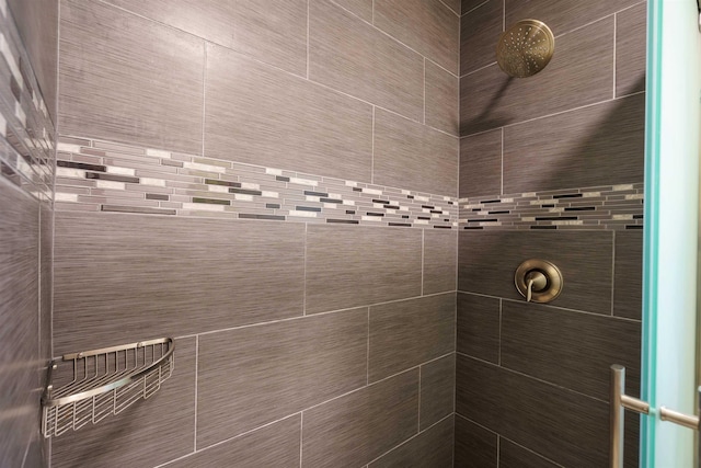 bathroom with tiled shower