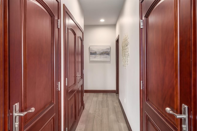 corridor featuring light hardwood / wood-style floors