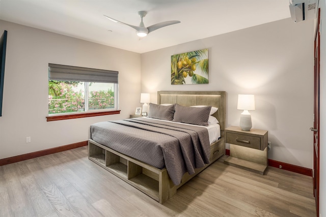 bedroom featuring ceiling fan and light hardwood / wood-style floors