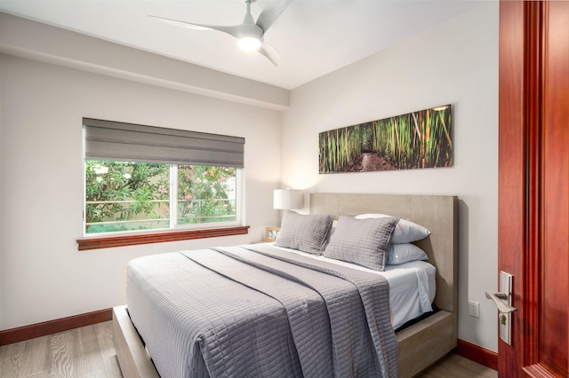 bedroom featuring ceiling fan and hardwood / wood-style floors