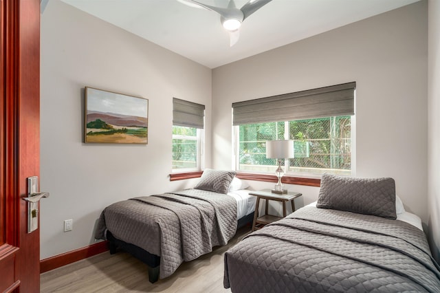 bedroom featuring light wood-type flooring and ceiling fan