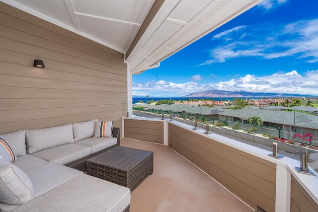 balcony with a mountain view and an outdoor living space