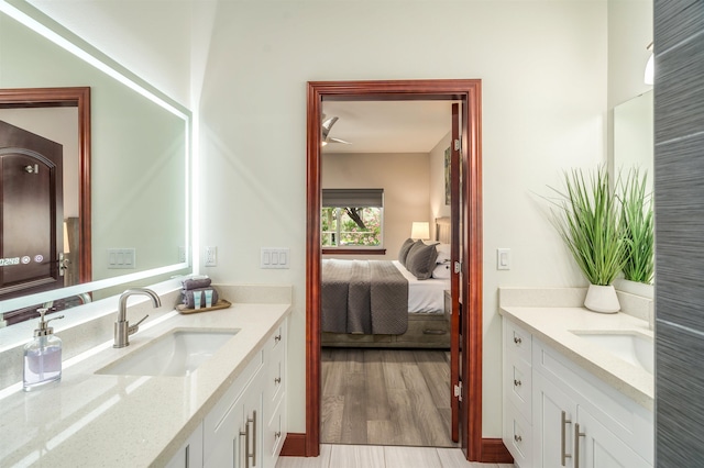 bathroom with vanity and hardwood / wood-style flooring