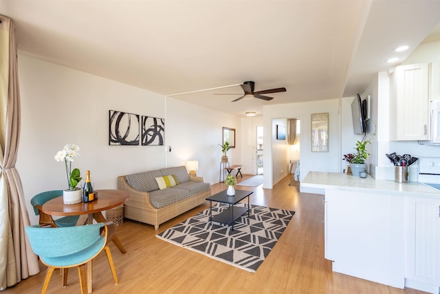 3823 Lower Honoapiilani Rd Unit 302, Lahaina, HI 96761 - living area featuring a ceiling fan and light wood finished floors