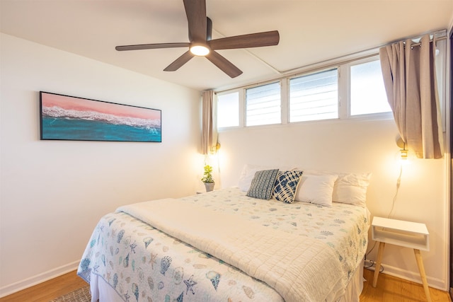3823 Lower Honoapiilani Rd Unit 302, Lahaina, HI 96761 - bedroom with light wood-style floors, baseboards, and a ceiling fan