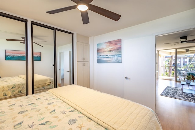 3823 Lower Honoapiilani Rd Unit 302, Lahaina, HI 96761 - bedroom featuring two closets, wood finished floors, and a ceiling fan