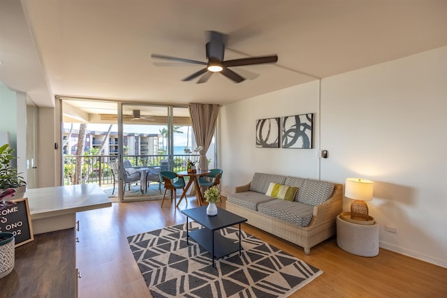 3823 Lower Honoapiilani Rd Unit 302, Lahaina, HI 96761 - living room featuring ceiling fan, wood finished floors, and baseboards