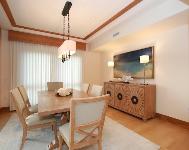 dining space with light hardwood / wood-style floors