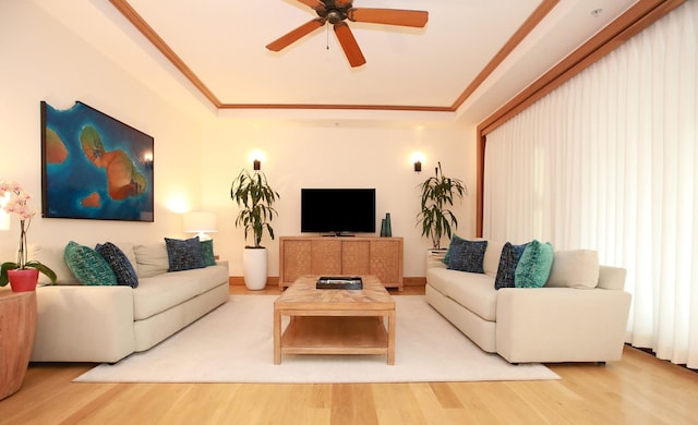 living room featuring wood-type flooring and ceiling fan