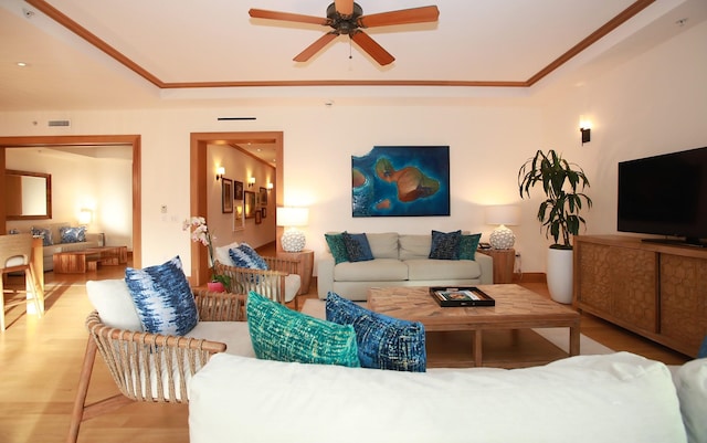 living room featuring ceiling fan and hardwood / wood-style floors