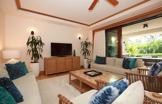 living room featuring ceiling fan and light hardwood / wood-style flooring