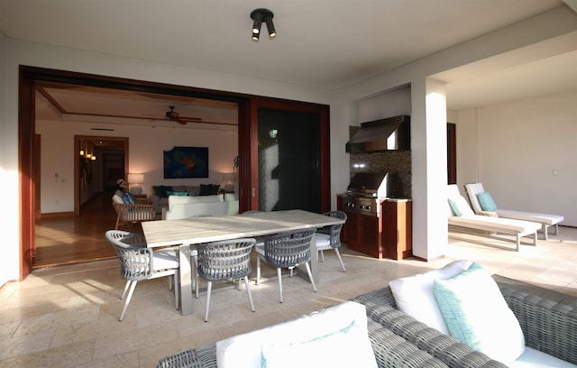 dining room featuring tile floors and ceiling fan