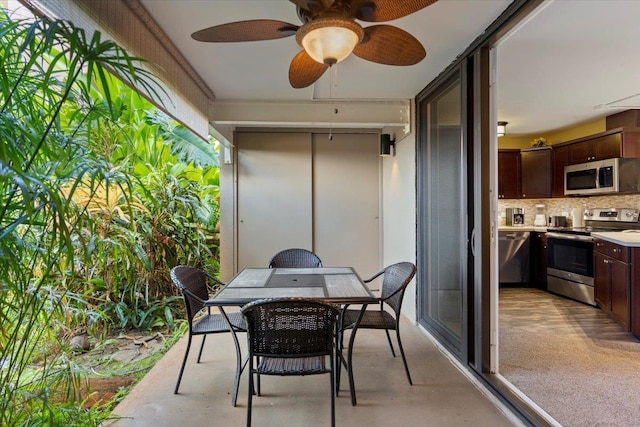 balcony with area for grilling, ceiling fan, and a patio