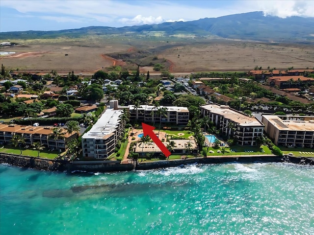 bird's eye view with a water and mountain view