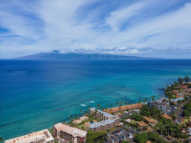 exterior space with a water and mountain view