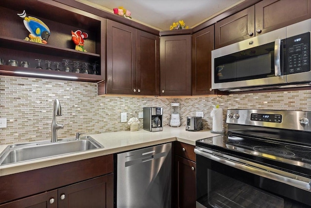 kitchen with dark brown cabinetry, sink, stainless steel appliances, and backsplash