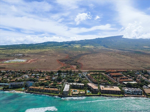 birds eye view of property featuring a water and mountain view