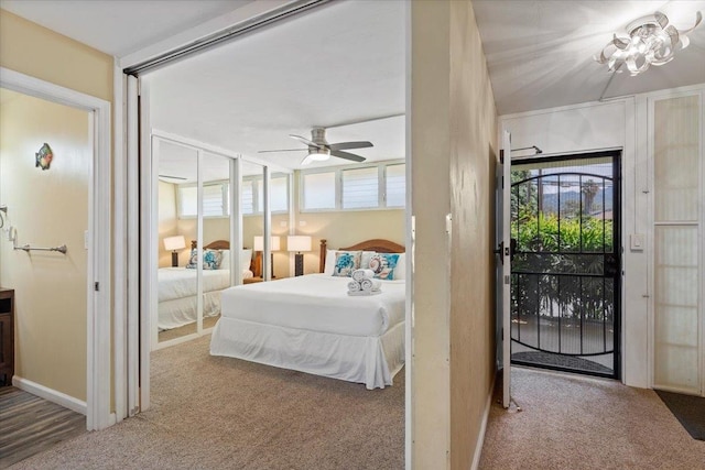 carpeted bedroom with ceiling fan and access to exterior