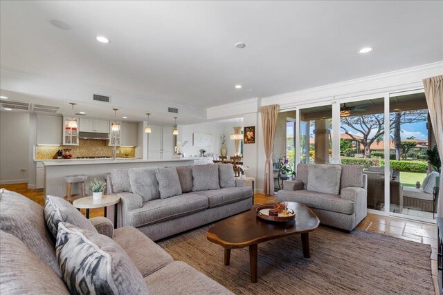 357 Umeke St Unit 144, Kihei, HI 96753 - living area featuring crown molding, recessed lighting, and visible vents