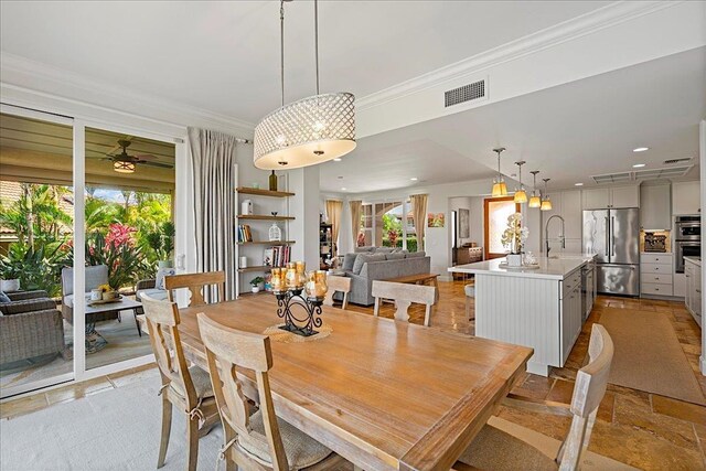 357 Umeke St Unit 144, Kihei, HI 96753 - dining area with crown molding, recessed lighting, visible vents, and a wealth of natural light
